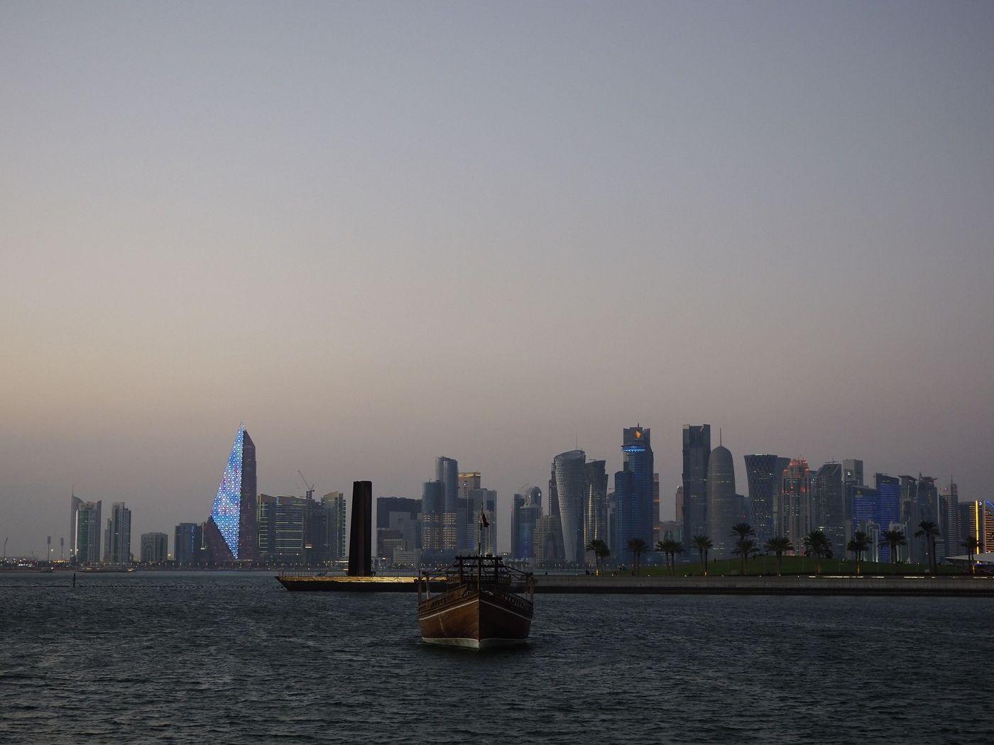 Gulf city waterfront under heavy summer haze