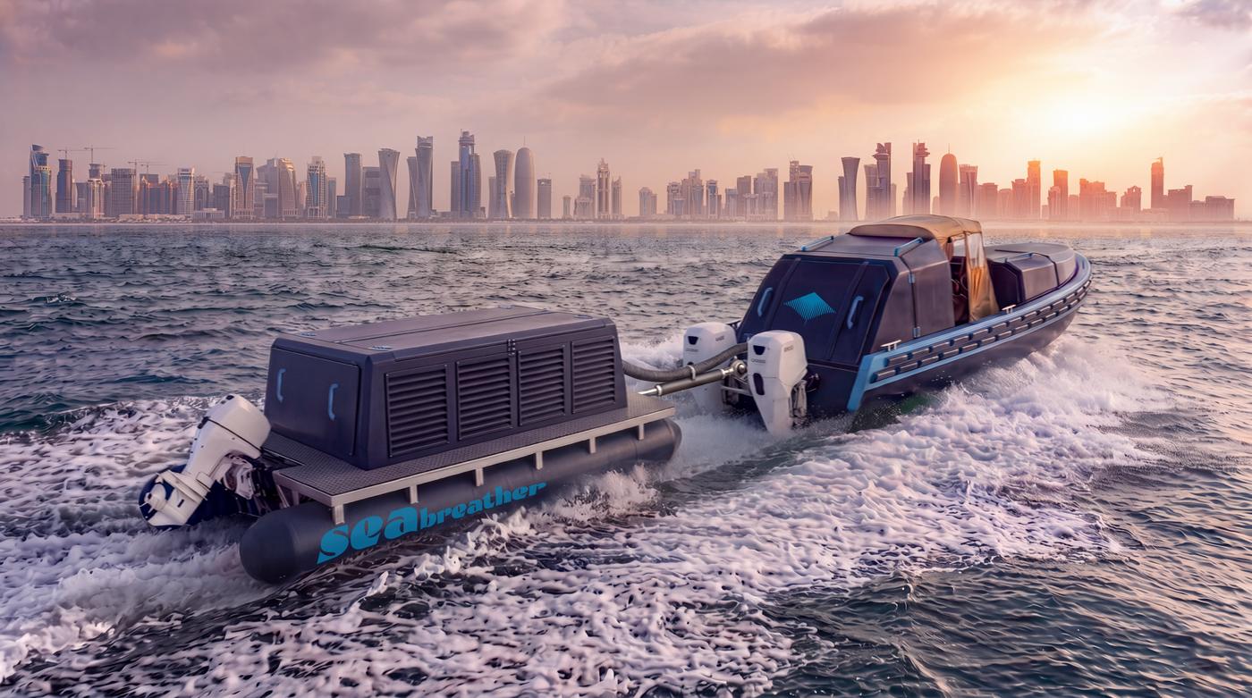 A Super SeaBreather — vessel and gas barge running together — off the Doha skyline at sunset